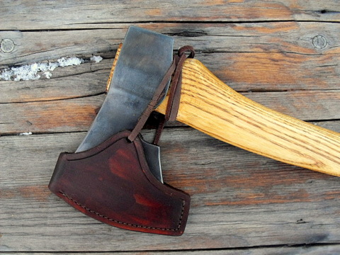 hand-forged custom axe with leather sheath