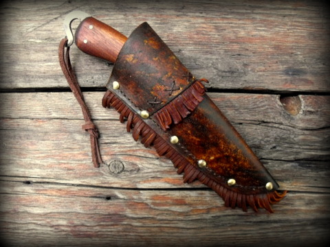 custom period frontier belt knife with a decorated rawhide sheath