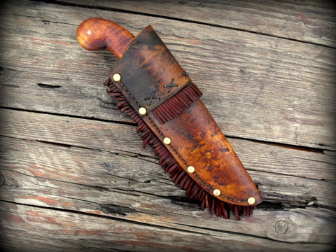 hand forged period belt  knife  with a rawhide sheath