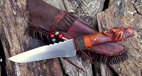 belt knife with carved wolf head grip and frontier sheath