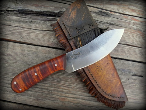 frontier Nessmuk belt knife with a rawhide sheath