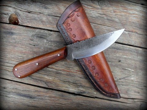 roach belly knife with a leather sheath
