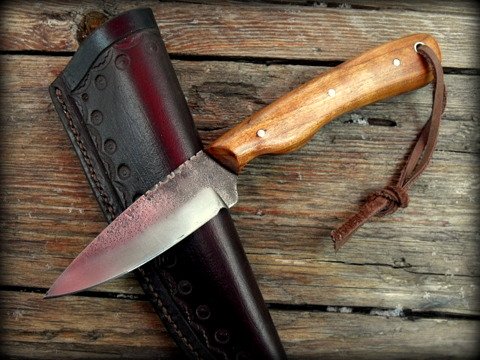  bird and trout knife with a tooled leather sheath