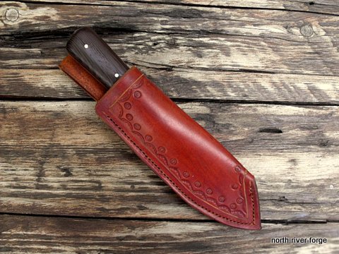 hand made custom knife with a leather sheath