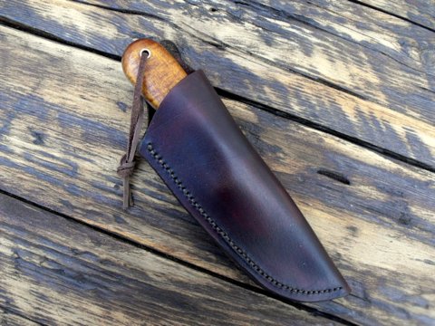 vintage style knife with a leather sheath