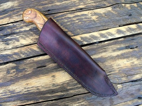 Bowie knife with a leather sheath