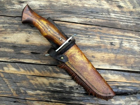 Hand forged frontier Bowie knife with a rawhide sheath