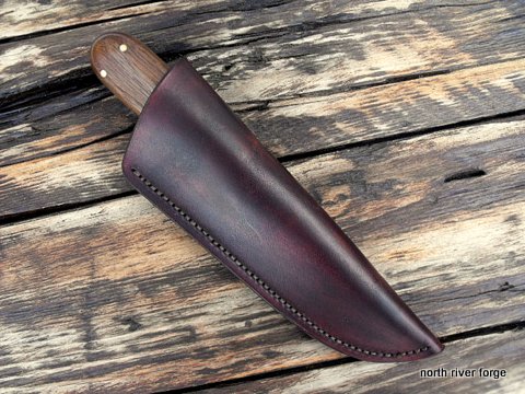 hand made custom knife with a leather sheath