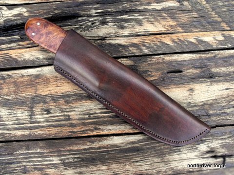 heavy-duty belt knife with a leather sheath